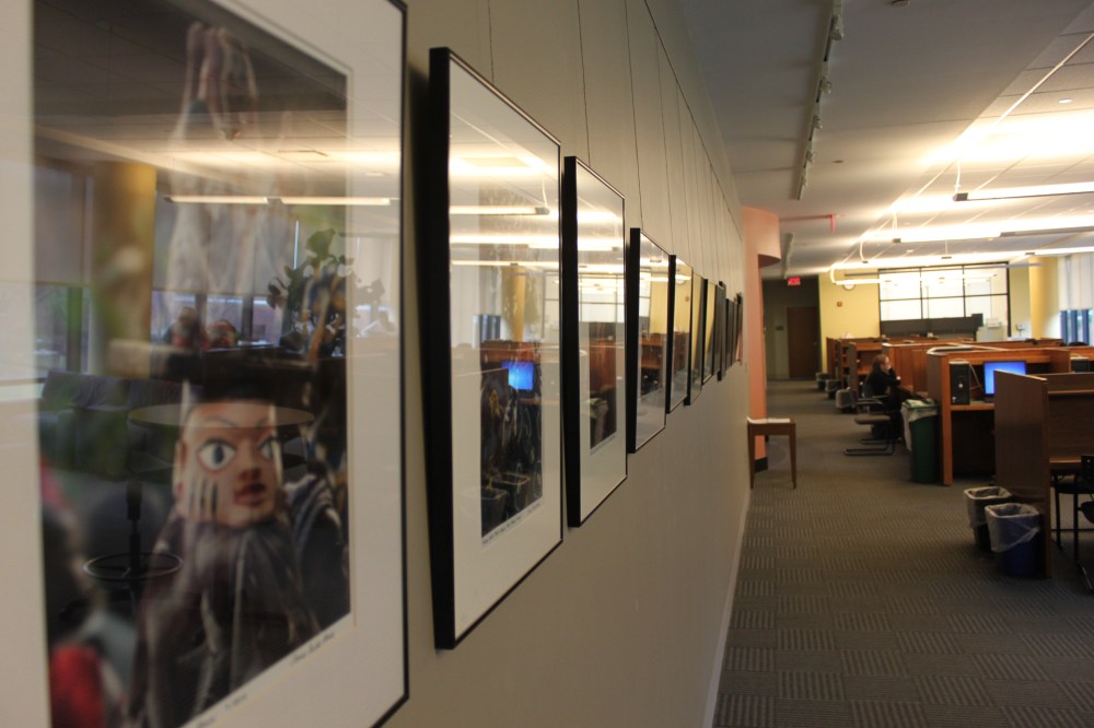 The long expansive wall of photographs.